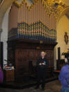 The tour guide in front ot the church organ